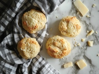 Three cheese scones on a kitchen counter top